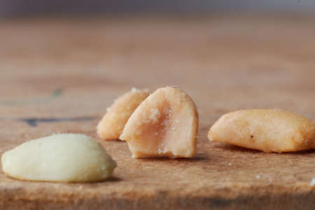 macro photo of nuts on a wooden table, peanuts, beer snacks, blurred backgroundの写真素材