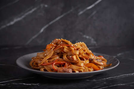 pasta with meat, spaghetti, noodles, plate on a dark background, asian cuisineの写真素材