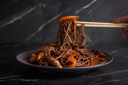 pasta with meat, spaghetti, noodles, plate on a dark background, asian cuisineの写真素材