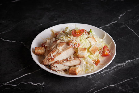 asian salad with meat and seafood, shrimp, plate close-up on a dark backgroundの写真素材