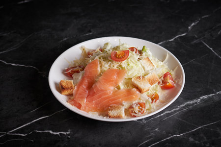 asian salad with meat and seafood, shrimp, plate close-up on a dark backgroundの写真素材