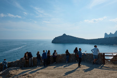 people on the view point at the sea, wild landscape, mountain trail, tourist route, sea viewのeditorial素材