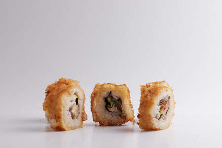 One roll in focus, a portion of rolls out of focus, Asian food, sushi and fish dishの写真素材