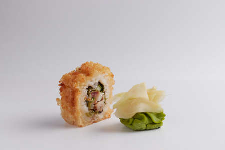 several different rolls on the table, Asian food, side view, light background, sushi, ginger and wasabiの写真素材
