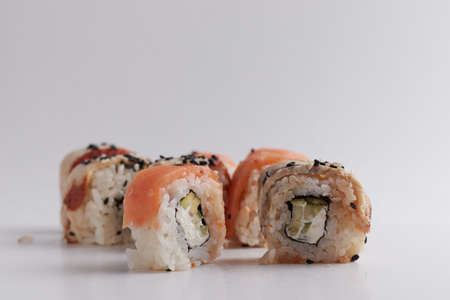 One roll in focus, a portion of rolls out of focus, Asian food, sushi and fish dishの写真素材