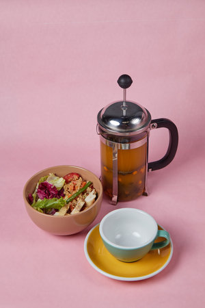 breakfast on table, rice with vegetables and drink, side view, monochromatic delicate backgroundの写真素材