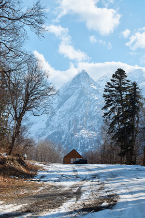 A house in the mountains, a village on a slope, snow cliffs, life in the mountains, a house on top of a mountainの写真素材