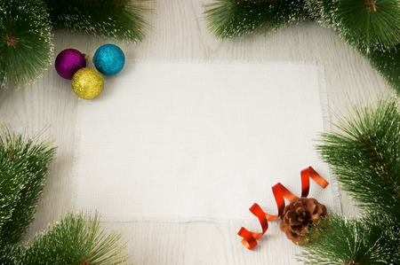 Christmas card with decoration on a wooden board with copy space の写真素材