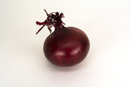 Red onion isolated on whiteの写真素材