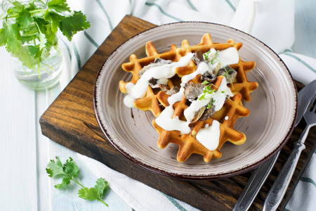 Corn waffles with mushrooms and sauce. Selective focus.の写真素材
