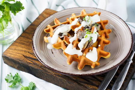 Corn waffles with mushrooms and sauce. Selective focus.の写真素材