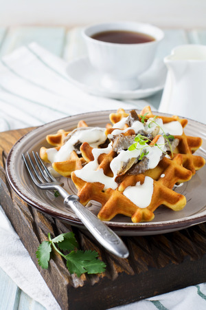 Corn waffles with mushrooms and sauce. Selective focus.の写真素材