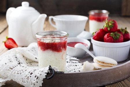 Strawberry rice pudding served in jar.Healthy breakfast. Selective focus.の写真素材