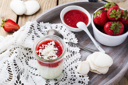 Strawberry rice pudding served in jar.Healthy breakfast. Selective focus.の写真素材