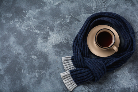 Cup of hot Ginger tea with lemon and honey on dark gray background. Top view. Copy space.の写真素材