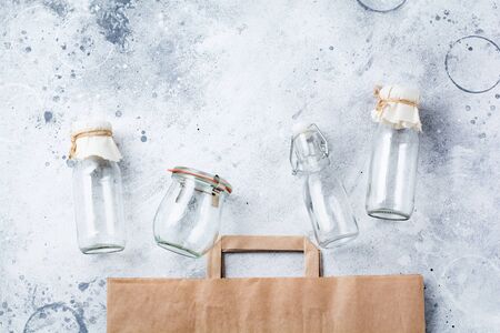 Zero waste concept. Eco-friendly paper bag and glass jar for free plastic shopping. Top view.の写真素材