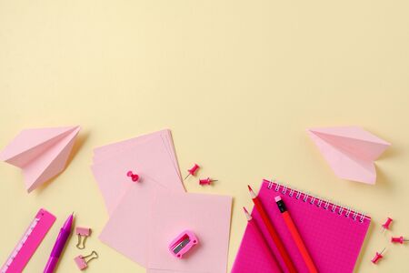 Notebook, colored pencils, ruler, pen, eraser, sharpener and more. School and office stationery on yellow background. Concept back to school. Top view.の写真素材