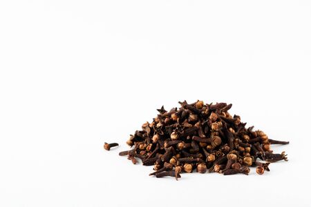 Cloves. Dry seasoning for cooking and drinks isolated on a white background.の写真素材