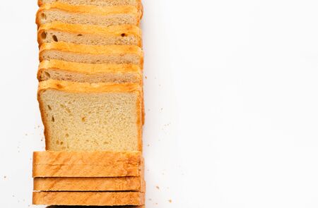 Sliced toast bread on a white background. Top view, flat lay