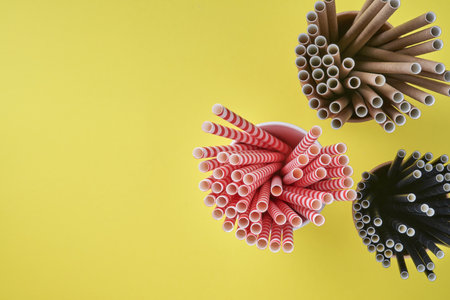 Drinking tubes red and brown made of paper and cornstarch, biodegradable material and eco paper...