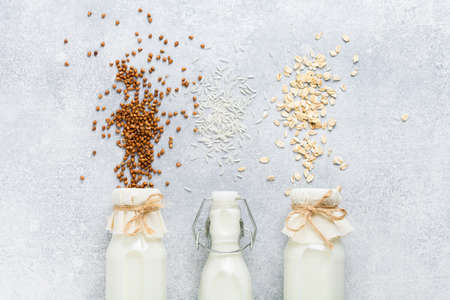 Homemade diet vegetable milk made from rice on a gray background. Diet healthy concept. Copy space and Banner.Top view.の写真素材