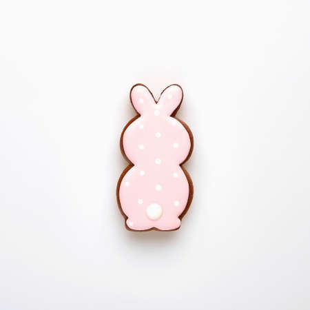 Easter symbol pink bunny gingerbread isolated on white. Top view.