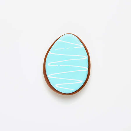 Easter symbol blue gingerbread egg isolated on white. Top view.