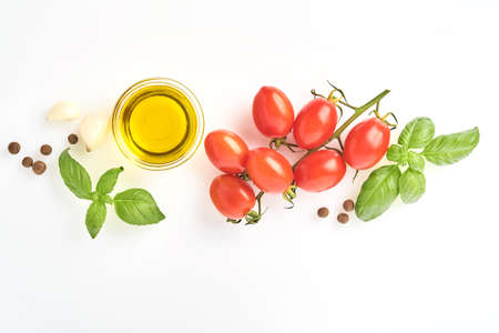 Spaghetti, fresh tomato, herbs and spices. Composition of healthy food ingredients isolated on white...