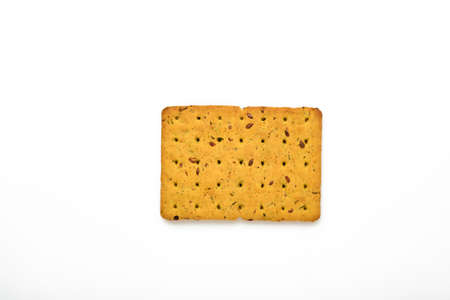 Cracker with flax seeds and oat bran rectangular shape for healthy, dietary and balanced diet isolated on white background. Snack for proper nutrition.の写真素材