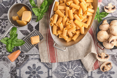 Pasta. italian pasta. Variety of traditional italian pasta: colorful spaghetti, tagliatelle, farfalle, penne, ptititm, noodle, fusilli, cannelloni on an old stone background. Top view with copy space.の写真素材