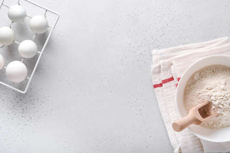 Ingredients for cooking homemade baking. Baking background with flour, eggs, kitchen tools, utensils...