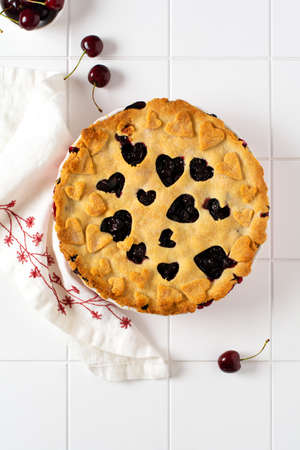 Homemade open cherry pie with lattice on a gray concrete background. Selective focus. Top viewの写真素材