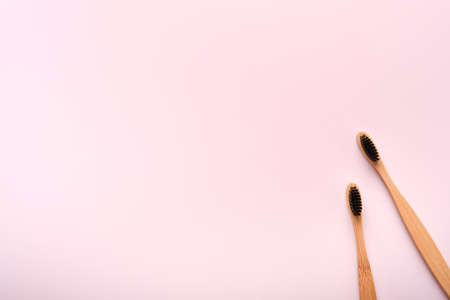 Teeth hygiene and oral dental care products on pink color background with copy space. Eco-friendly...