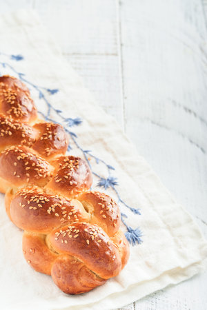 Challah bread. Sabbath kiddush ceremony composition. Freshly baked homemade braided challah bread...