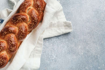 Sabbath kiddush ceremony composition. Challah bread. Freshly baked homemade braided challah bread...