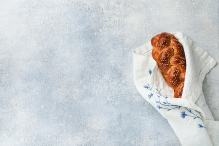Sabbath kiddush ceremony composition. Challah bread. Freshly baked homemade braided challah bread...