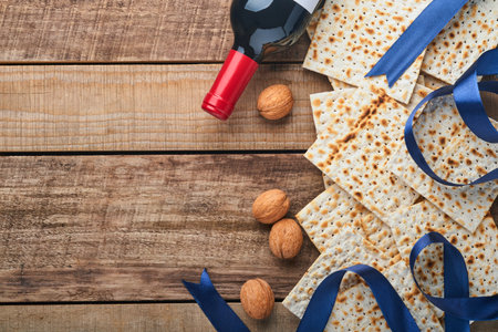 Matzah, red kosher and walnut. Traditional ritual Jewish bread on old wooden rustic background....