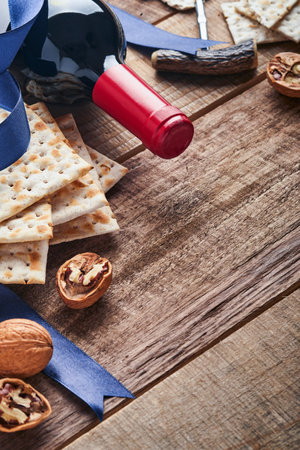 matzah and walnut. Traditional ritual Jewish bread on old wooden rustic background. Passover food. Pesach Jewish holiday of Passover celebration concept.の写真素材