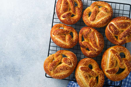 Bavarian pretzels and glass of lager beer. Oktoberfest food menu, traditional salted pretzels on...