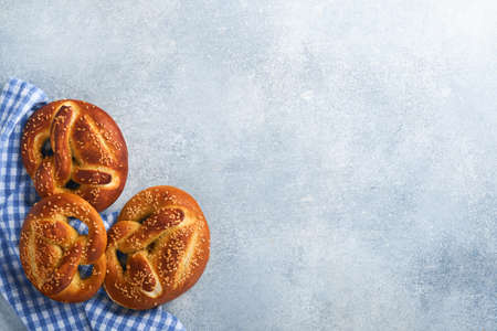Bavarian pretzels and glass of lager beer. Oktoberfest food menu, traditional salted pretzels on...