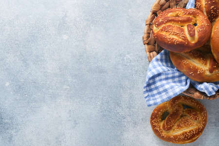 Bavarian pretzels and glass of lager beer. Oktoberfest food menu, traditional salted pretzels on...