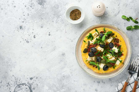 Scrambled eggs. Light, Fluffy and Buttery Scrambled Eggs with feta cheese, sun-dried tomatoes and...