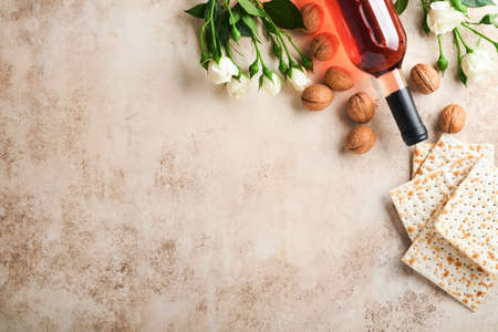 Passover celebration concept. Matzah, red kosher walnut and spring beautiful rose flowers.....