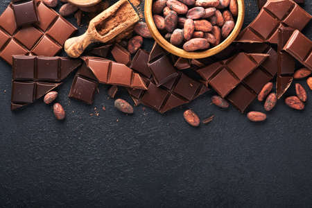 chocolate. Composition of cocoa powder, grated and bean cocoa bars and pieces of different milk and...
