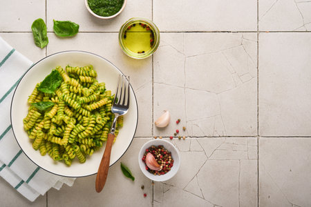Italian Fusilli Pasta with Pesto. Fusilli pasta with basil pesto and herbs, parmesan cheese, basil...