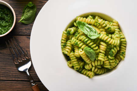 Italian Fusilli Pasta with Pesto. Fusilli pasta with basil pesto and herbs, parmesan cheese, basil...