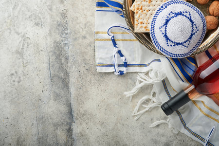 Passover celebration concept. Matzah, red kosher and walnut. Traditional ritual Jewish bread matzah,...
