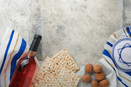 Passover celebration concept. Matzah, red kosher and walnut. Traditional ritual Jewish bread matzah,...