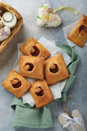 Valentines day heart shaped Hand pies. Mini puff pastry or hand pies stuffed with apple and sprinkle...