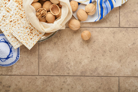 Passover celebration concept. Matzah, red kosher and walnut. Traditional ritual Jewish bread matzah,...